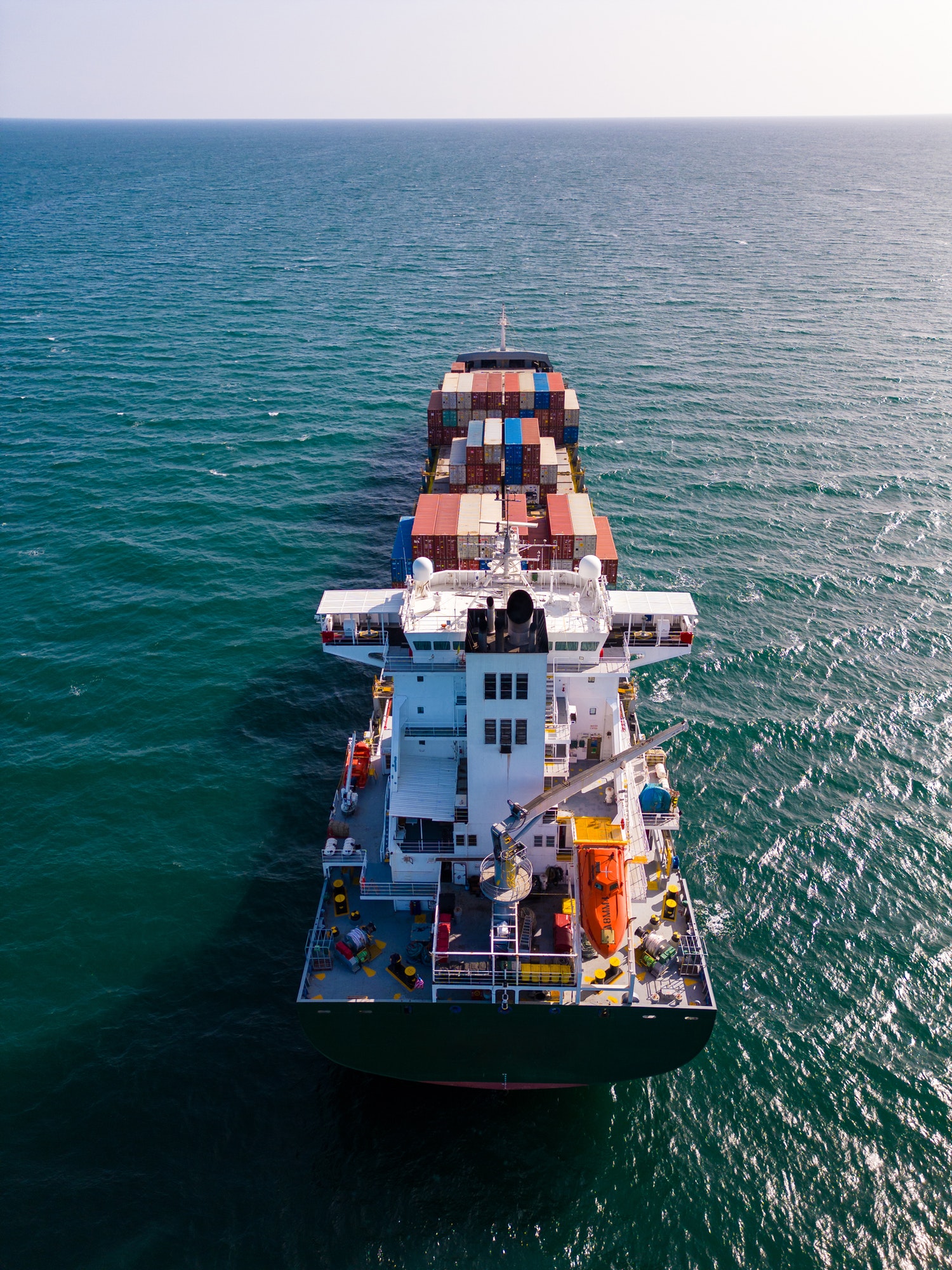 A container ship in the sea, aerial view